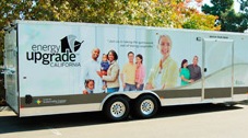 CCSE's Energy Upgrade California Roadshow takes homeowner education on the road across the Golden State. Photo of a trailer with the Energy Upgrade California logo and graphics painted on the side.