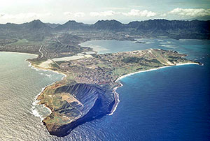 Photo of the HINMREC Kaneohe Bay site. Shows a hilly peninsula jutting out into the ocean.