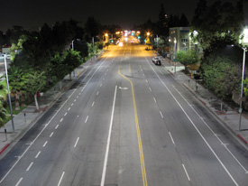 A number of available financing methods make LED streetlights a viable option for many municipalities today. <em>Photo Credit: Los Angeles Bureau of Streetlighting</em> photo of an urban roadway at night lined with LED streetlights.