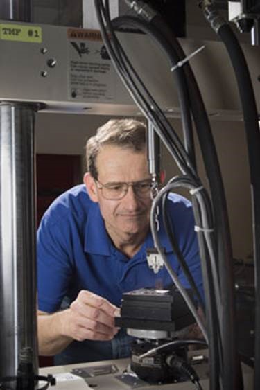 Sandia National Laboratories researcher Paul Vianco works on thin films, nanometer-thick layers of metal that can be defined into precision electrical circuits.