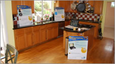 Open house signs placed throughout a kitchen with hardwood floors