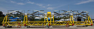 Photo of the the ORPC Tid Gen device set up on dry land, made up of several interconnected tidal units.