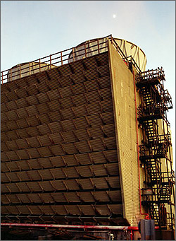 Geothermal power plants use cooling towers, like these at The Geysers, to safely reject waste heat into the atmosphere. Photo of cooling towers at a geothermal power plant at The Geysers in California.