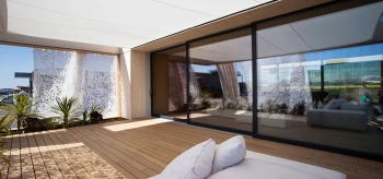 The solar-powered house built by students from Team Austria of the Vienna Institute of Technology for Solar Decathlon took a design-centered approach to shading the structure's exterior. | Photo from Jason Flakes/U.S. Department of Energy Solar Decathlon The solar-powered house built by students from Team Austria of the Vienna Institute of Technology for Solar Decathlon took a design-centered approach to shading the structure's exterior. | Photo from Jason Flakes/U.S. Department of Energy Solar Decathlon