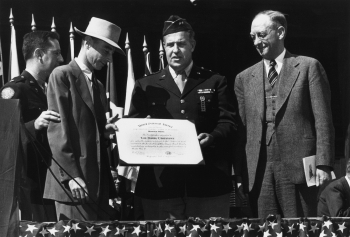Los Alamos National Laboratory presents an award to J. Robert Oppenheimer (second from left) at the end of World War II, c. 1945.
Los Alamos National Laboratory presents an award to J. Robert Oppenheimer (second from left) at the end of World War II, c. 1945.