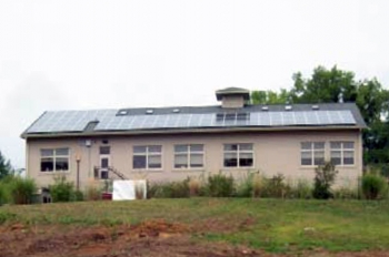 The public library in Esopus, New York, used Recovery Act funds to install two photovoltaic arrays expected to generate 31,200 kWh of electricity annually -- approximately 30 percent of the libraryâs electricity use and a savings of nearly $4,000 in energy costs each year. | Photo courtesy of New York State Energy Research and Development Authority (NYSERDA). The public library in Esopus, New York, used Recovery Act funds to install two photovoltaic arrays expected to generate 31,200 kWh of electricity annually -- approximately 30 percent of the libraryâs electricity use and a savings of nearly $4,000 in energy costs each year. | Photo courtesy of New York State Energy Research and Development Authority (NYSERDA).