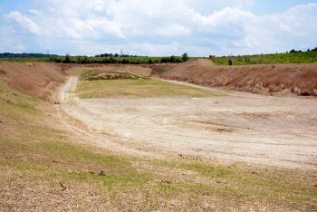 A view of the site of the former X-114A Firing Range. The berms and stockpile area of the range were reseeded to prevent soil erosion. A view of the site of the former X-114A Firing Range. The berms and stockpile area of the range were reseeded to prevent soil erosion.