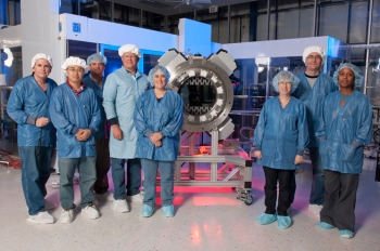 Researchers at Fermi National Lab team stand beside the 570-megapixels, five-ton Dark Energy camera, which will be capable of measuring the expansion of the universe - and developing better models about how dark energy works. | Photo by Reidar Hahn, Fermi National Lab Researchers at Fermi National Lab team stand beside the 570-megapixels, five-ton Dark Energy camera, which will be capable of measuring the expansion of the universe - and developing better models about how dark energy works. | Photo by Reidar Hahn, Fermi National Lab