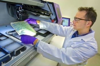 A researcher at the Joint Bioenergy Institute at Berkeley National Lab chooses bacteria colonies in their efforts to create a game-changing biofuel from sustainable, energy-dense plants, such as switchgrass. The JBEI is one example of the ability for Energy Department labs to form scientific partnerships designed to hurdle an energy barrier with transformative technology. | Photo courtesy of Berkeley National Lab. A researcher at the Joint Bioenergy Institute at Berkeley National Lab chooses bacteria colonies in their efforts to create a game-changing biofuel from sustainable, energy-dense plants, such as switchgrass. The JBEI is one example of the ability for Energy Department labs to form scientific partnerships designed to hurdle an energy barrier with transformative technology. | Photo courtesy of Berkeley National Lab.