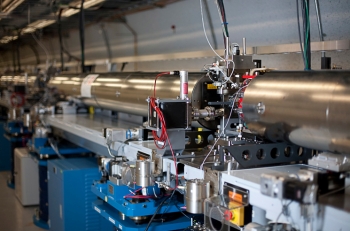 SLACâs linac accelerates very short pulses of electrons to 99.9999999 percent the speed of light through a slalom that causes the electrons to emit X-rays, which become synchronized as they interact with the electron pulses and create the worldâs brightest X-ray laser pulse. | Photo by Brad Plummer, SLAC. SLACâs linac accelerates very short pulses of electrons to 99.9999999 percent the speed of light through a slalom that causes the electrons to emit X-rays, which become synchronized as they interact with the electron pulses and create the worldâs brightest X-ray laser pulse. | Photo by Brad Plummer, SLAC.