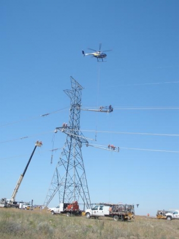 A helicopter hoists platforms for linemen during the construction of this single-circuit 500-kilovolt tower â one of hundreds on the McNary-John Day line saving BPA big bucks. | Photo courtesy of Bonneville Power Administration A helicopter hoists platforms for linemen during the construction of this single-circuit 500-kilovolt tower â one of hundreds on the McNary-John Day line saving BPA big bucks. | Photo courtesy of Bonneville Power Administration