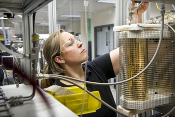 Engineer Whitney Jablonski works in the thermochemical lab at NREL's campus in Golden, Colorado. | Photo by Dennis Schroeder, NREL. Engineer Whitney Jablonski works in the thermochemical lab at NREL's campus in Golden, Colorado. | Photo by Dennis Schroeder, NREL.