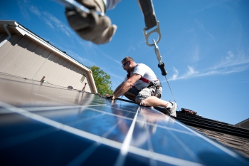 Brian Webster installs rooftop solar panels on a home in Englewood, Colorado. The Energy Department is working to streamline rooftop solar installations so that its faster, easier and cheaper for Americans to go solar. | Photo courtesy of Dennis Schroeder, NREL. Brian Webster installs rooftop solar panels on a home in Englewood, Colorado. The Energy Department is working to streamline rooftop solar installations so that its faster, easier and cheaper for Americans to go solar. | Photo courtesy of Dennis Schroeder, NREL.
