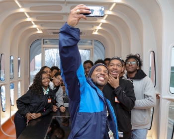 Roderick Jackson and a group of high schoolers pause for a selfie inside Oak Ridge National Lab's 3D-printed house. | Photo Courtesy of Oak Ridge National Lab. Roderick Jackson and a group of high schoolers pause for a selfie inside Oak Ridge National Lab's 3D-printed house. | Photo Courtesy of Oak Ridge National Lab.
