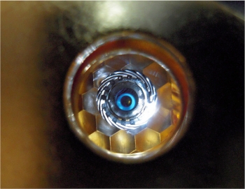 A view of a cryogenically cooled National Ignition Facility (NIF) target as "seen" by the laser through the hohlraum's laser entrance hole. | Photo courtesy of Lawrence Livermore National Laboratory. A view of a cryogenically cooled National Ignition Facility (NIF) target as "seen" by the laser through the hohlraum's laser entrance hole. | Photo courtesy of Lawrence Livermore National Laboratory.