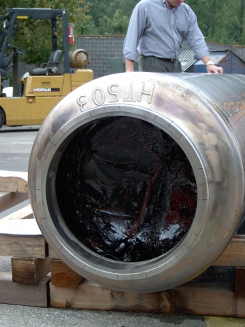 A canister filled with nonradioactive glass sits on display. A canister filled with nonradioactive glass sits on display.