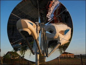 In the photo above, a mirrored parabolic dish directs sunbeams to a central point, where a device absorbs the solar heat to make syngas, solar-boosted natural gas. This new system was recognized with a 2014 R&D 100 Award. | Photo courtesy of Pacific Northwest National Lab. In the photo above, a mirrored parabolic dish directs sunbeams to a central point, where a device absorbs the solar heat to make syngas, solar-boosted natural gas. This new system was recognized with a 2014 R&D 100 Award. | Photo courtesy of Pacific Northwest National Lab.