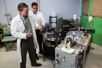 Researchers demonstrate General Electric's magnetocaloric system. | Photo courtesy of General Electric Researchers demonstrate General Electric's magnetocaloric system. | Photo courtesy of General Electric