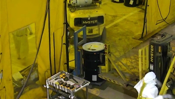 Workers overpack the old drums in new drums before sending them for characterization and processing based on the type of waste inside of them. Workers overpack the old drums in new drums before sending them for characterization and processing based on the type of waste inside of them.