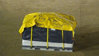 The final waste box, the last of the containers that held more than 50,000 cubic meters of waste, is wrapped and awaiting removal from the Retrieval Contamination Enclosure, located inside the Transuranic Storage Area-Retrieval Enclosure. The work was performed by employees working on the Idaho Cleanup Project Core contract. The final waste box, the last of the containers that held more than 50,000 cubic meters of waste, is wrapped and awaiting removal from the Retrieval Contamination Enclosure, located inside the Transuranic Storage Area-Retrieval Enclosure. The work was performed by employees working on the Idaho Cleanup Project Core contract.
