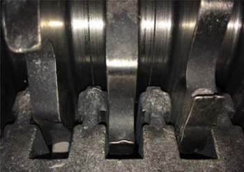 A view of the redesigned auger-grinderâs head following the recent demonstration. A view of the redesigned auger-grinderâs head following the recent demonstration.
