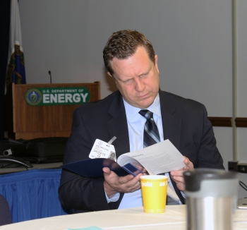 Dr. David Danielson, Assistant Secretary for Energy Efficiency and Renewable Energy, reads an energy open data pamphlet during the networking breakfast before the first-ever Energy Open Data Roundtable on April 29 in Washington, D.C. | <em>Photo by Mike Mueller for the Energy Department</em> Dr. David Danielson, Assistant Secretary for Energy Efficiency and Renewable Energy, reads an energy open data pamphlet during the networking breakfast before the first-ever Energy Open Data Roundtable on April 29 in Washington, D.C. | <em>Photo by Mike Mueller for the Energy Department</em>