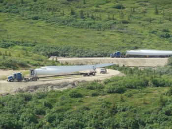 Wind turbine blades are transported up the 10-mile-long, narrow dirt road to the Eva Creek Wind Farm site. | Photo courtesy of Golden Valley Electric Association Wind turbine blades are transported up the 10-mile-long, narrow dirt road to the Eva Creek Wind Farm site. | Photo courtesy of Golden Valley Electric Association