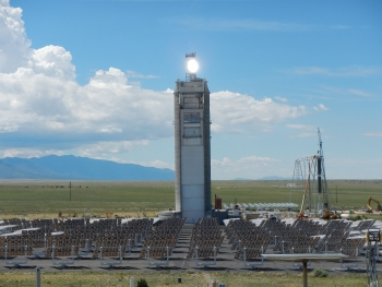 Sunlight reflected from heliostats is shining directly on the particle receiver, which is currently being tested on top of the solar tower at the National Solar Thermal Test Facility. Sunlight reflected from heliostats is shining directly on the particle receiver, which is currently being tested on top of the solar tower at the National Solar Thermal Test Facility.