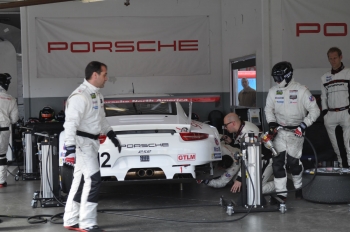 A crew works on the Porsche 911 GTLM car, which runs on cellulosic ethanol. | Photo by Natalie Committee, Energy Department A crew works on the Porsche 911 GTLM car, which runs on cellulosic ethanol. | Photo by Natalie Committee, Energy Department