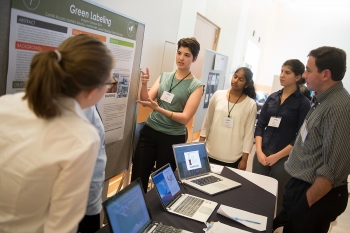 A student participating in the Imagine Tomorrow competition explains her team's idea for green labeling. | Energy Department photo A student participating in the Imagine Tomorrow competition explains her team's idea for green labeling. | Energy Department photo