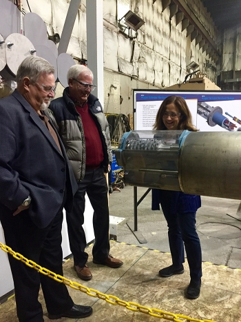 Mike Wiemers, an IWTU technical expert with contractor Fluor Idaho, center, shows the redesigned auger-grinder to EM Associate Principal Deputy Assistant Secretary Frank Marcinowski, left, and EM Assistant Secretary Monica Regalbuto. Mike Wiemers, an IWTU technical expert with contractor Fluor Idaho, center, shows the redesigned auger-grinder to EM Associate Principal Deputy Assistant Secretary Frank Marcinowski, left, and EM Assistant Secretary Monica Regalbuto.