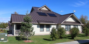 Energy-efficient homes in AHAâs Sunrise Acres Complex include such features as rooftop solar domestic hot water. Photo from Akwesasne Housing Authority. Energy-efficient homes in AHAâs Sunrise Acres Complex include such features as rooftop solar domestic hot water. Photo from Akwesasne Housing Authority.