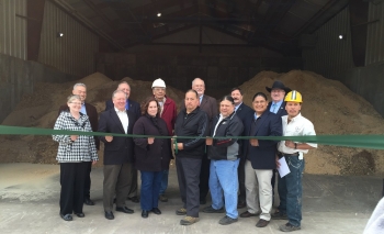 On April 20, Office of Indian Energy Director Chris Deschene (second from right) joined other key stakeholders for the official opening of the Menominee Tribal Enterprises biomass combined heat and power district energy plant in Wisconsin. Photo from Menominee Tribal Enterprises. On April 20, Office of Indian Energy Director Chris Deschene (second from right) joined other key stakeholders for the official opening of the Menominee Tribal Enterprises biomass combined heat and power district energy plant in Wisconsin. Photo from Menominee Tribal Enterprises.