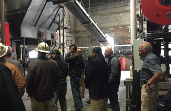 Touring the Menominee Tribal Enterprises biomass combined heat and power district energy plant in Wisconsin, which will generate an estimated 1,020,217 kilowatt-hours of renewable electricity per yearâequivalent to the annual electricity use of 97 homes. Photo from Menominee Tribal Enterprises. Touring the Menominee Tribal Enterprises biomass combined heat and power district energy plant in Wisconsin, which will generate an estimated 1,020,217 kilowatt-hours of renewable electricity per yearâequivalent to the annual electricity use of 97 homes. Photo from Menominee Tribal Enterprises.
