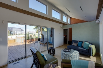 Passive solar design uses carefully designed overhangs and reflective coatings on windows, exterior walls, and roofs to provide comfort during the cooling season. | Photo courtesy of Jason Flakes, U.S. Department of Energy Passive solar design uses carefully designed overhangs and reflective coatings on windows, exterior walls, and roofs to provide comfort during the cooling season. | Photo courtesy of Jason Flakes, U.S. Department of Energy