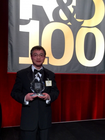 Dr. Jianping Yu, the lead researcher on the cyanobacterial bioethylene project, at the R&D 100 Award ceremony with the award. Photo courtesy NREL. Dr. Jianping Yu, the lead researcher on the cyanobacterial bioethylene project, at the R&D 100 Award ceremony with the award. Photo courtesy NREL.