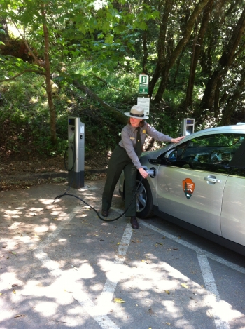 A park ranger charges an electric vehicle at Golden Gate National Recreation Area in California. Golden Gate is partnering with San Francisco Clean Cities for a series of projects for the <a href="http://www1.eere.energy.gov/cleancities/national_parks.html">Clean Cities National Parks Initiative</a>. Nine new projects have been announced as part of the initiative. | Photo courtesy of National Parks Service A park ranger charges an electric vehicle at Golden Gate National Recreation Area in California. Golden Gate is partnering with San Francisco Clean Cities for a series of projects for the <a href="http://www1.eere.energy.gov/cleancities/national_parks.html">Clean Cities National Parks Initiative</a>. Nine new projects have been announced as part of the initiative. | Photo courtesy of National Parks Service
