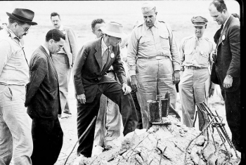 General Leslie Groves and J. Robert Oppenheimer are pictured here at the Trinity Test site in New Mexico, 1945. General Leslie Groves and J. Robert Oppenheimer are pictured here at the Trinity Test site in New Mexico, 1945.