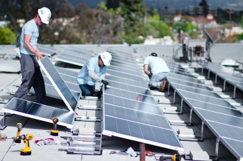Installing a rooftop solar array as part of Los Angeles County's Feed-in Tariff program. | Photo courtesy of the Los Angeles Business Council. Installing a rooftop solar array as part of Los Angeles County's Feed-in Tariff program. | Photo courtesy of the Los Angeles Business Council.