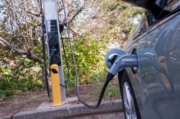 A Chevrolet Volt charges in Rhode Island thanks to a ChargePoint station installed using funding from the American Reinvestment and Recovery Act. | Photo courtesy of NREL A Chevrolet Volt charges in Rhode Island thanks to a ChargePoint station installed using funding from the American Reinvestment and Recovery Act. | Photo courtesy of NREL