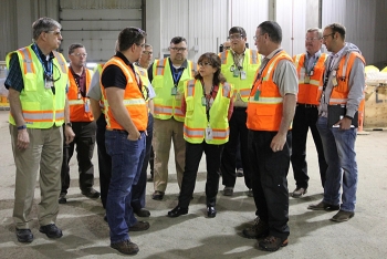 EM Assistant Secretary Monica Regalbuto, center, receives a briefing on EMâs cleanup operations from Idaho Site employees. EM Assistant Secretary Monica Regalbuto, center, receives a briefing on EMâs cleanup operations from Idaho Site employees.