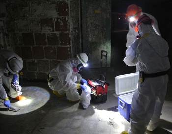 Crew members prepare samples for shipment to the laboratory for analysis. Crew members prepare samples for shipment to the laboratory for analysis.