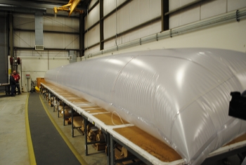 Workers at the Containment Fabrication Facility created an engineered equipment removal sleeve for elevated wind speed applications. Workers at the Containment Fabrication Facility created an engineered equipment removal sleeve for elevated wind speed applications.