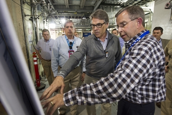Integrated Waste Treatment Unit (IWTU) Operations Project Manager Craig Olson, right, discusses a newly redesigned component of the IWTU with Energy Secretary Rick Perry, center right; Fluor Idaho Program Manager Fred Hughes, center left; and U.S. Rep. Mike Simpson (Idaho), left. Integrated Waste Treatment Unit (IWTU) Operations Project Manager Craig Olson, right, discusses a newly redesigned component of the IWTU with Energy Secretary Rick Perry, center right; Fluor Idaho Program Manager Fred Hughes, center left; and U.S. Rep. Mike Simpson (Idaho), left.