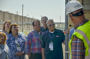 EMâs Dave Dollins of the Portsmouth/Paducah Project Office Paducah Site Office speaks to Site-Specific Advisory Board (SSAB) officers and others about groundwater contamination source remediation at the Paducah Gaseous Diffusion Plantâs C-400 Cleaning Building. A site tour was included in the two days of events at the EM SSAB Chairs meeting last week. EMâs Dave Dollins of the Portsmouth/Paducah Project Office Paducah Site Office speaks to Site-Specific Advisory Board (SSAB) officers and others about groundwater contamination source remediation at the Paducah Gaseous Diffusion Plantâs C-400 Cleaning Building. A site tour was included in the two days of events at the EM SSAB Chairs meeting last week.