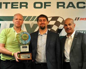 Karl Simon (from left) the Environmental Protection Agencyâs Director of Transportation and Climate Division for the Office of Transportation and Air Quality; Michael Carr, the Energy Departmentâs Principal Deputy Assistant Secretary for the Office of Energy Efficiency and Renewable Energy; and Scott Atherton, President of International Motor Sports Association; pose with the Green Racing Challenge award at the Rolex 24 at Daytona event last weekend. | Photo by Natalie Committee, Energy Department Karl Simon (from left) the Environmental Protection Agencyâs Director of Transportation and Climate Division for the Office of Transportation and Air Quality; Michael Carr, the Energy Departmentâs Principal Deputy Assistant Secretary for the Office of Energy Efficiency and Renewable Energy; and Scott Atherton, President of International Motor Sports Association; pose with the Green Racing Challenge award at the Rolex 24 at Daytona event last weekend. | Photo by Natalie Committee, Energy Department