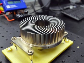 The Sandia Cooler's innovative, compact design combines a fan and a finned metal heat sink into a single element, efficiently transferring heat in microelectronics and reducing energy use. | Photo courtesy of Sandia National Laboratories. The Sandia Cooler's innovative, compact design combines a fan and a finned metal heat sink into a single element, efficiently transferring heat in microelectronics and reducing energy use. | Photo courtesy of Sandia National Laboratories.