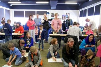 The intensity of kids and parents creating catapults can be seen in this âbulls eyeâ view of the launch action at the Museum of Idaho â Fluor Idahoâs Engineering Day. The intensity of kids and parents creating catapults can be seen in this âbulls eyeâ view of the launch action at the Museum of Idaho â Fluor Idahoâs Engineering Day.