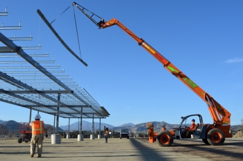 Construction workers build the frame for a 1-megawatt solar microgrid project at Fort Hunter Liggett, California. | <em>Photo courtesy of U.S. Army/Carlos J. Lazo</em> Construction workers build the frame for a 1-megawatt solar microgrid project at Fort Hunter Liggett, California. | <em>Photo courtesy of U.S. Army/Carlos J. Lazo</em>