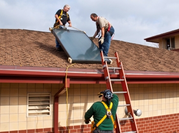 Installing a solar hot water system at a Milwaukee fire station. The installation was completed as part of the Midwest Renewable Energy Association's hands-on training workshop. System components were donated by local manufacturer, Caleffi. | Photo Courtesy of the National Renewable Energy Lab. Installing a solar hot water system at a Milwaukee fire station. The installation was completed as part of the Midwest Renewable Energy Association's hands-on training workshop. System components were donated by local manufacturer, Caleffi. | Photo Courtesy of the National Renewable Energy Lab.